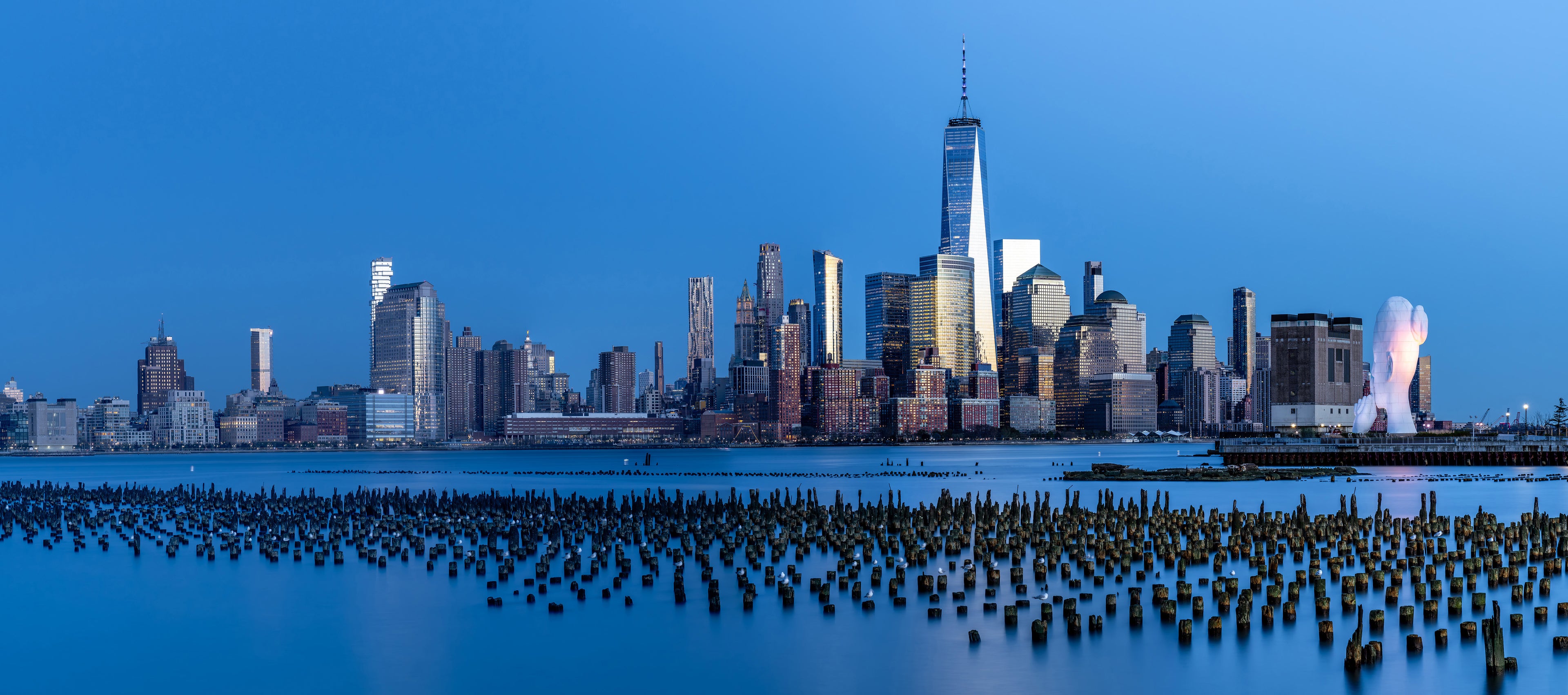 Lower Manhattan panorama from Jersey old pier posts sunset.jpg